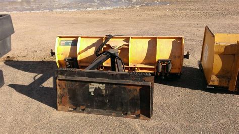 snowwolf plow skid steer